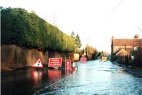Jude Cobbings, BGS © NERC 2003 - a road flooded by groundwater